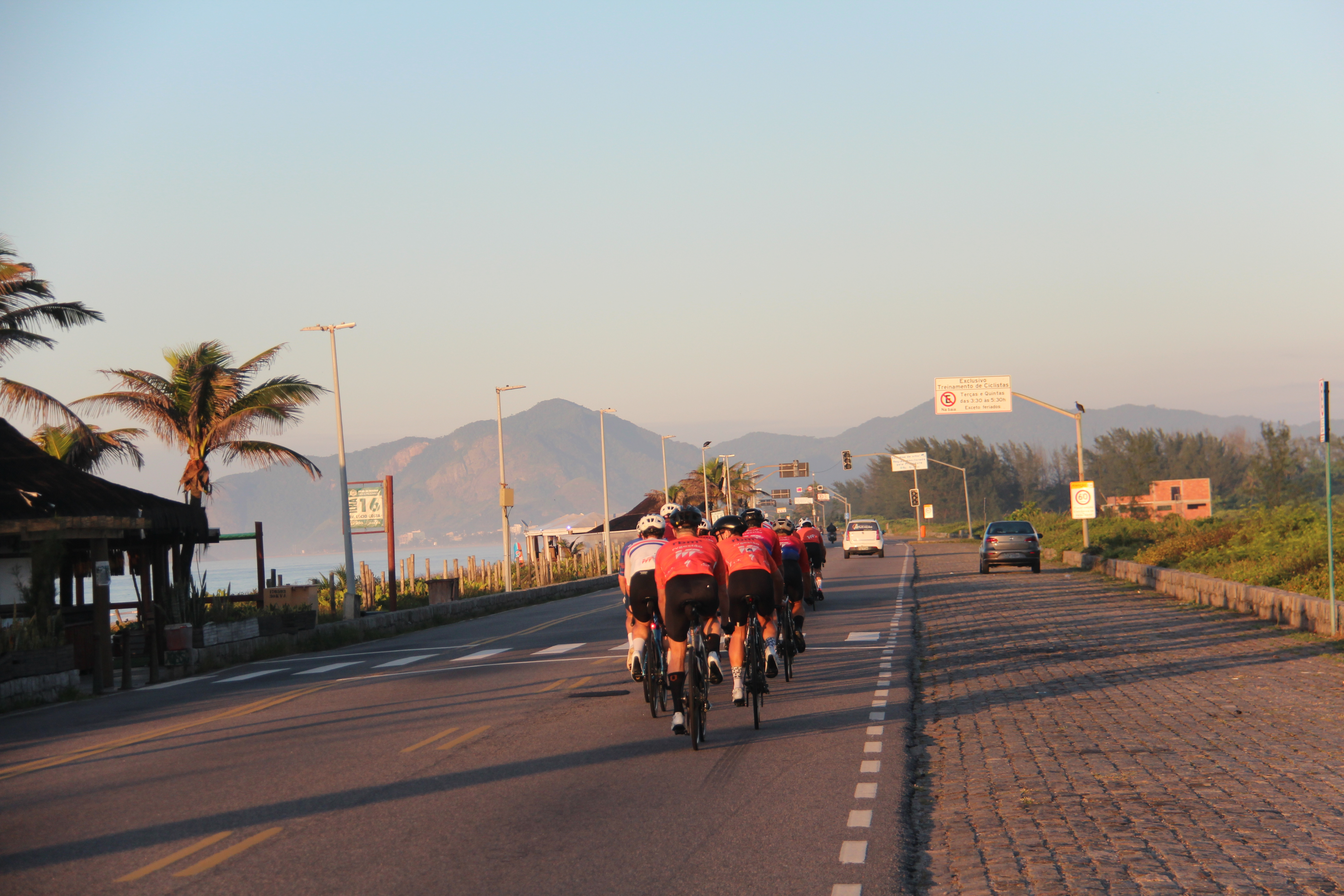 Group cycling at sunset